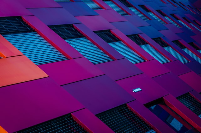 Multicolor Stucco Paint Ideas 5 image of pink and purple stucco on the facade of houses
