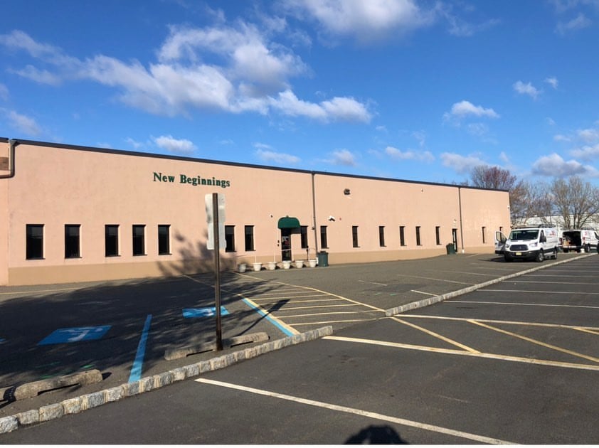 Fairfield NJ 3 New Beginnings center in Fairfield NJ with smooth tan stucco, crisp white trim and fresh protective finish
